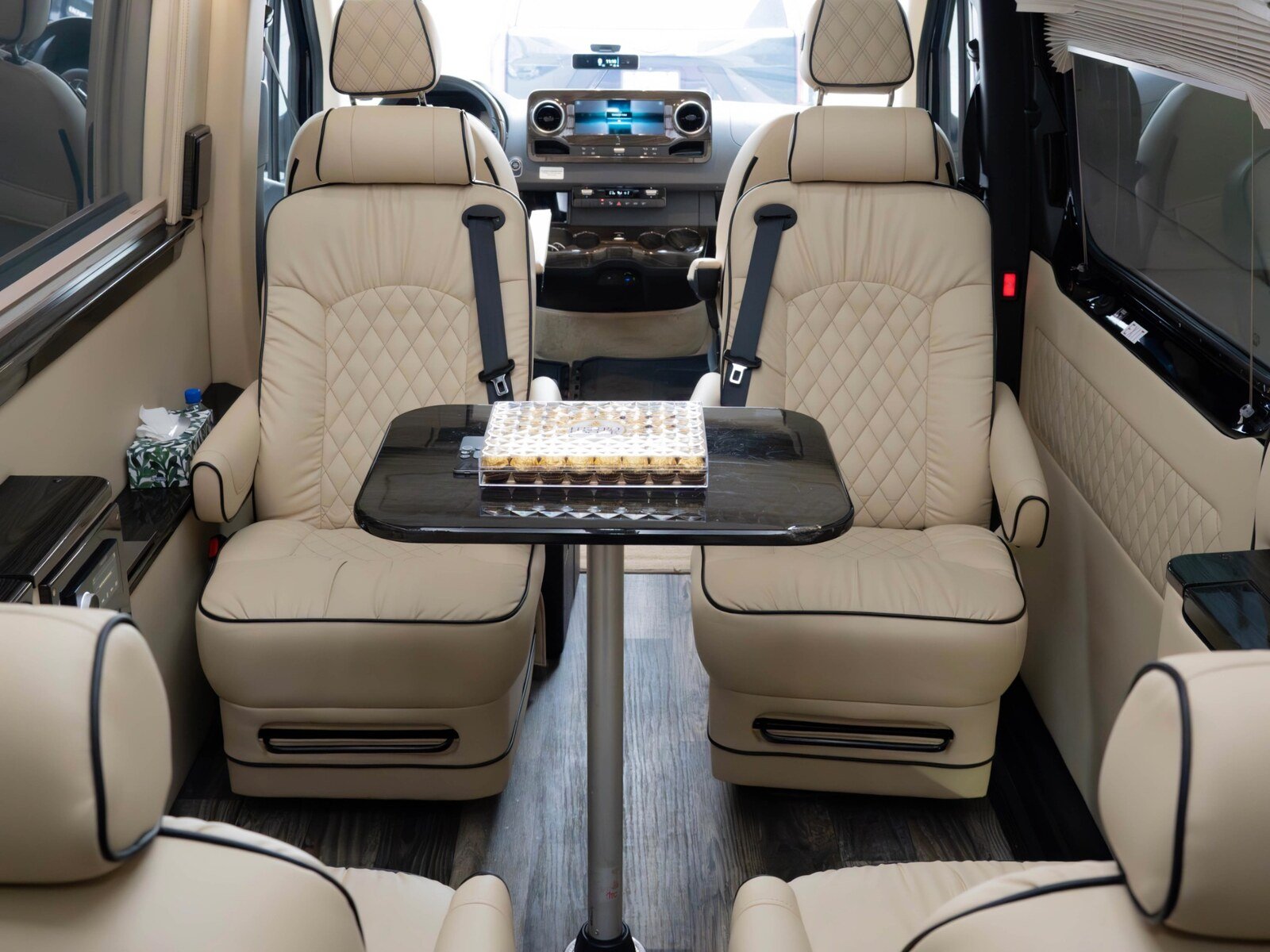 Nine-passenger Luxury Sprinter with cream private cabin for Toronto group chauffeur service